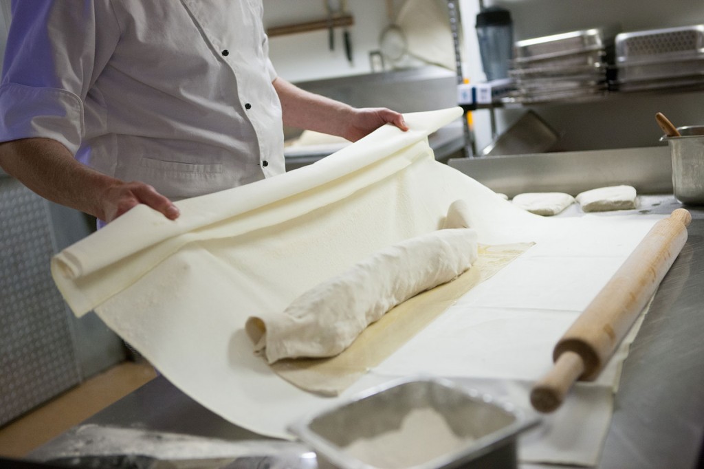 Carefully rolling the strudel